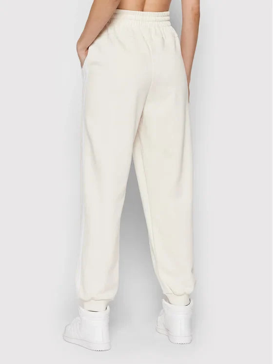 Adidas Pantaloni da tuta Essentials Studio Lounge 3-Stripes